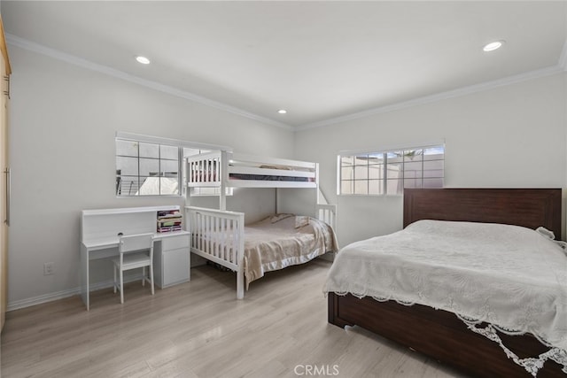 bedroom with crown molding, recessed lighting, baseboards, and wood finished floors