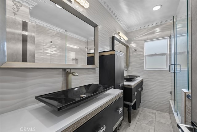 bathroom with vanity and a shower stall