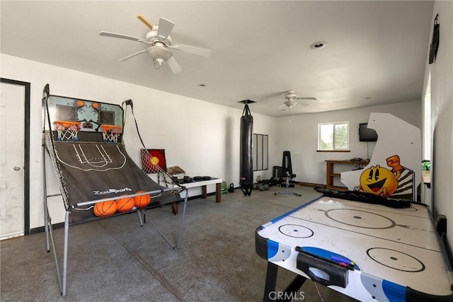 rec room featuring baseboards and ceiling fan
