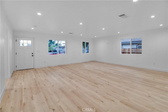 interior space featuring recessed lighting, visible vents, and light wood-type flooring