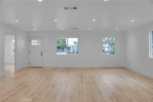 interior space featuring plenty of natural light, recessed lighting, and light wood-style floors