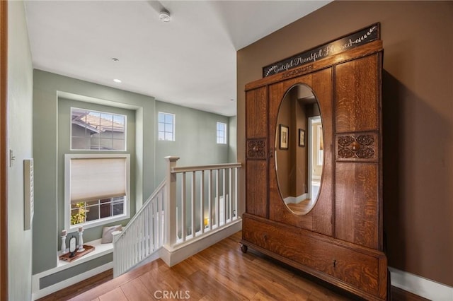 9 Woodlake Dr, Buena Park, CA 90621 - interior space with arched walkways and wood finished floors