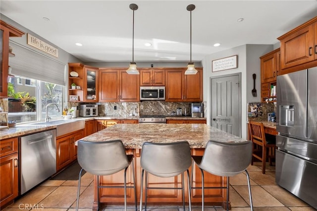 9 Woodlake Dr, Buena Park, CA 90621 - kitchen with brown cabinetry, a sink, appliances with stainless steel finishes, and tasteful backsplash