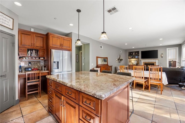 9 Woodlake Dr, Buena Park, CA 90621 - kitchen featuring stainless steel fridge, open floor plan, light tile patterned floors, tasteful backsplash, and visible vents