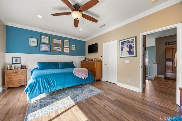 9 Woodlake Dr, Buena Park, CA 90621 - bedroom with crown molding, visible vents, wood finished floors, and a wainscoted wall