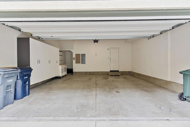 garage featuring a garage door opener and electric panel