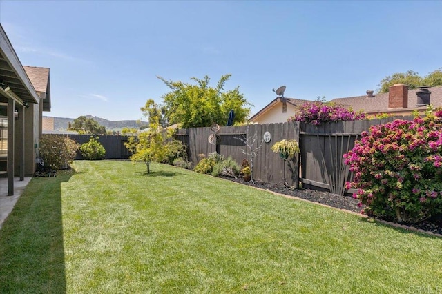 view of yard featuring a fenced backyard