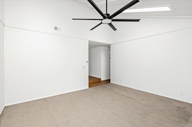unfurnished room featuring carpet floors, ceiling fan, visible vents, and baseboards