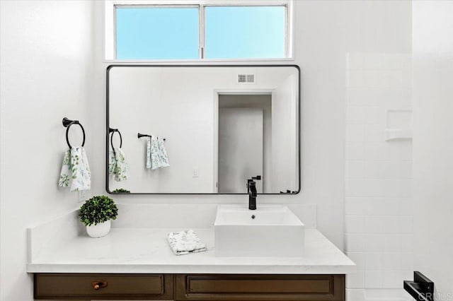 bathroom with visible vents and vanity