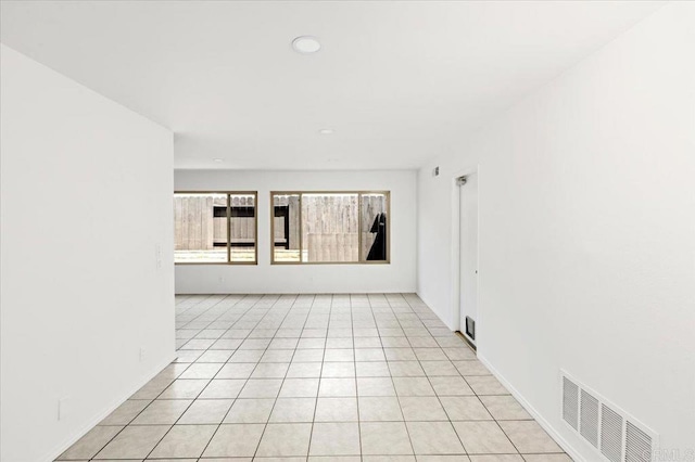 unfurnished room featuring recessed lighting, light tile patterned flooring, and visible vents