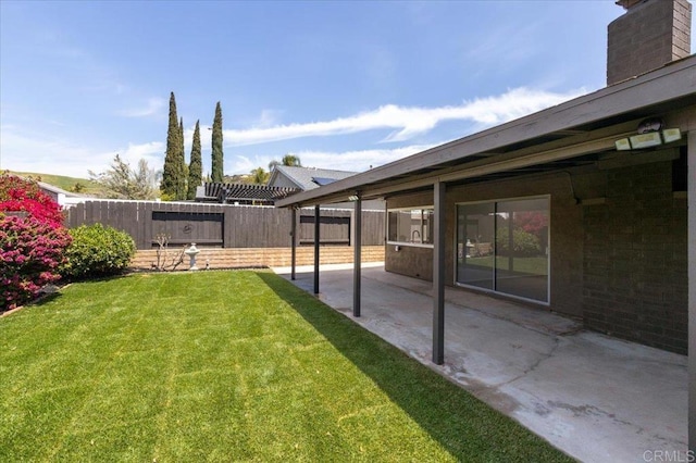 view of yard with a patio and a fenced backyard