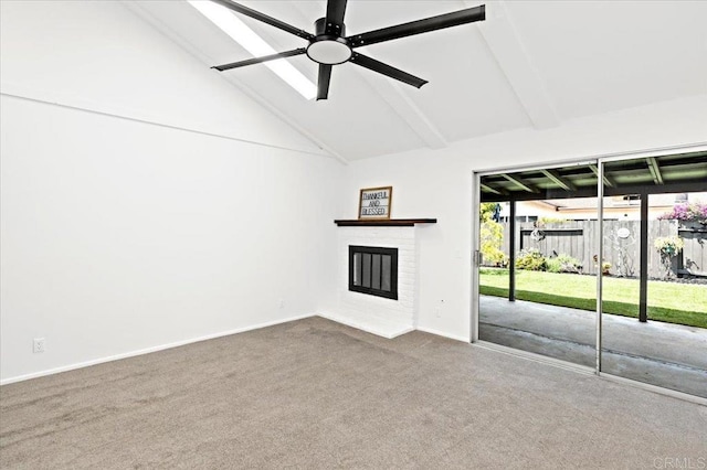 unfurnished living room featuring a ceiling fan, a fireplace, beam ceiling, baseboards, and carpet flooring