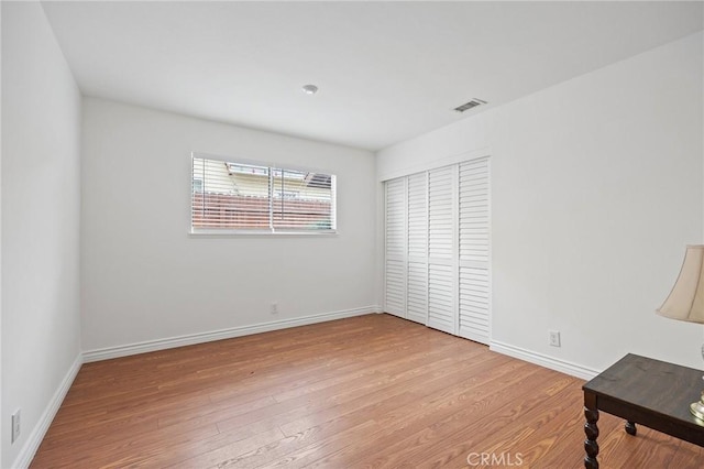 23692 Cavanaugh Rd, Lake Forest, CA 92630 - unfurnished bedroom with wood finished floors, baseboards, and a closet