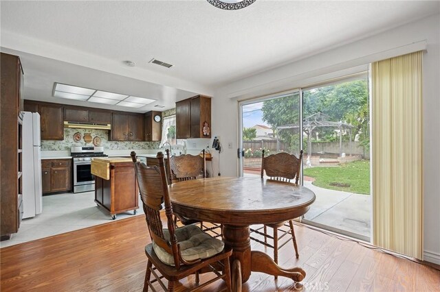 23692 Cavanaugh Rd, Lake Forest, CA 92630 - dining space featuring light wood-style flooring