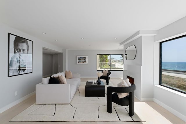 100 Coast Blvd Unit 101, La Jolla, CA 92037 - living room with a fireplace, baseboards, and recessed lighting