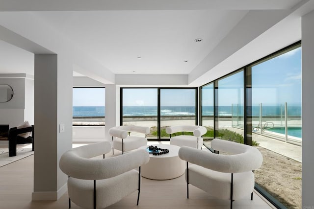 100 Coast Blvd Unit 101, La Jolla, CA 92037 - sitting room featuring plenty of natural light, light wood-type flooring, and a water view