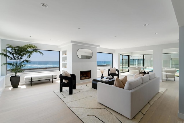 100 Coast Blvd Unit 101, La Jolla, CA 92037 - living room featuring a fireplace and wood finished floors