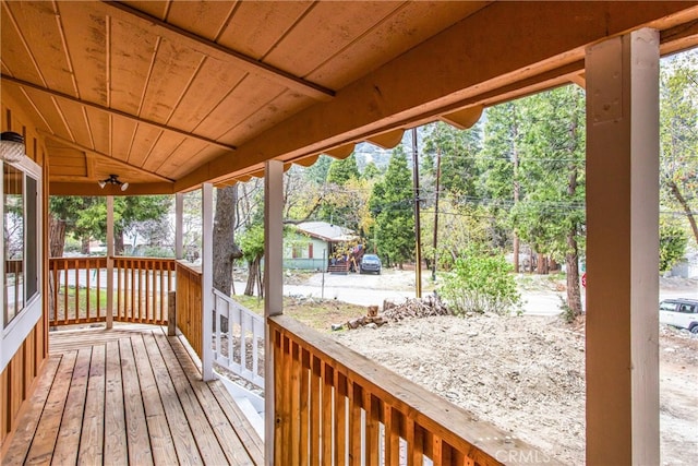 wooden terrace featuring covered porch