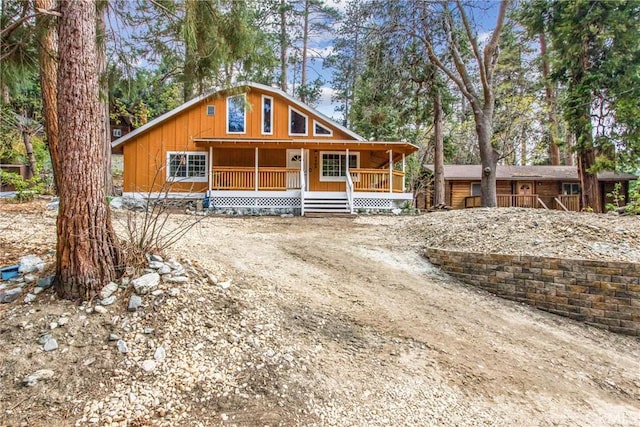 rustic home featuring a porch