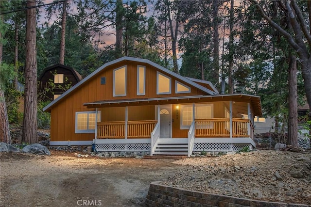 chalet / cabin with covered porch