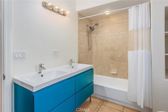 full bath featuring a sink, tile patterned floors, shower / bathtub combination with curtain, and double vanity