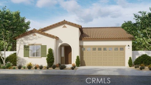 mediterranean / spanish-style home with a garage, stucco siding, and driveway