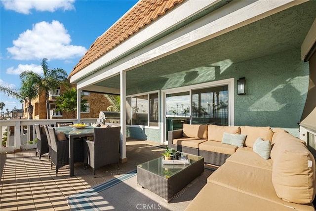 view of patio with outdoor dining area and outdoor lounge area