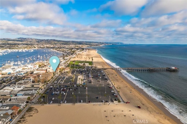 bird's eye view with a water view and a view of the beach