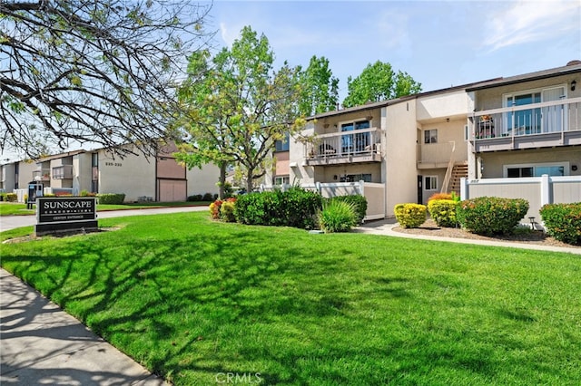 8990 19th St Unit 360, Rancho Cucamonga, CA 91701 - view of property's community featuring a yard and fence