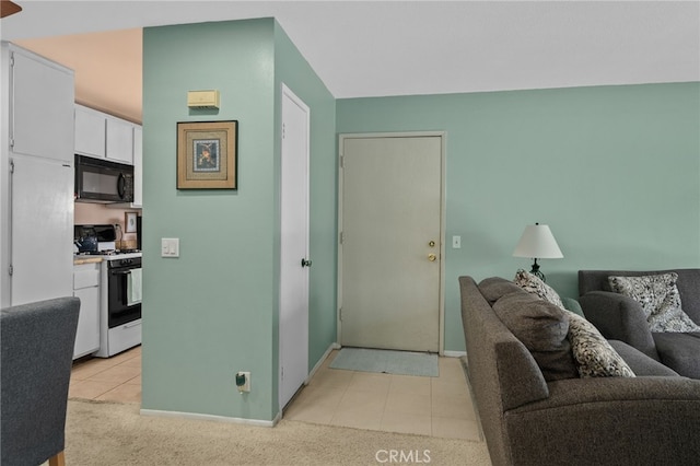 8990 19th St Unit 360, Rancho Cucamonga, CA 91701 - living area with baseboards, light colored carpet, and light tile patterned floors