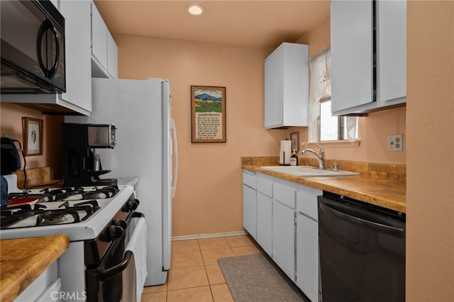 8990 19th St Unit 360, Rancho Cucamonga, CA 91701 - kitchen featuring a sink, light tile patterned floors, white cabinets, light countertops, and black appliances