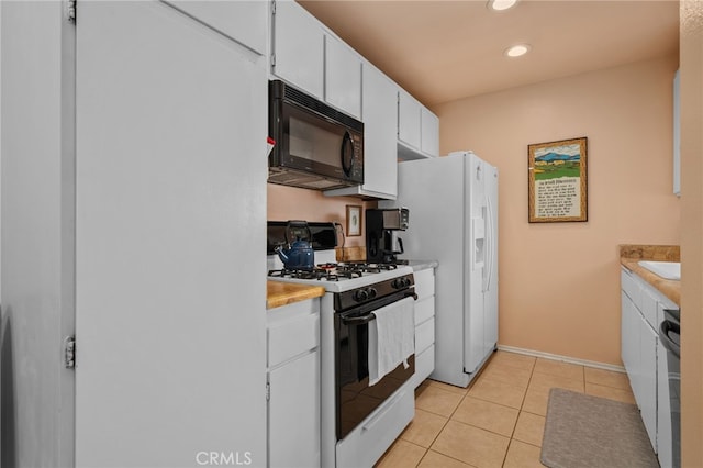 8990 19th St Unit 360, Rancho Cucamonga, CA 91701 - kitchen featuring light countertops, light tile patterned floors, white appliances, and white cabinetry