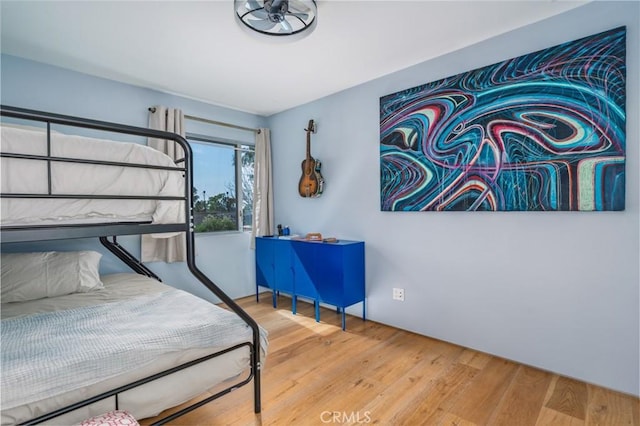 bedroom with wood finished floors