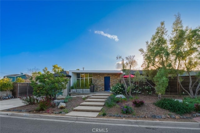 view of front of house with fence