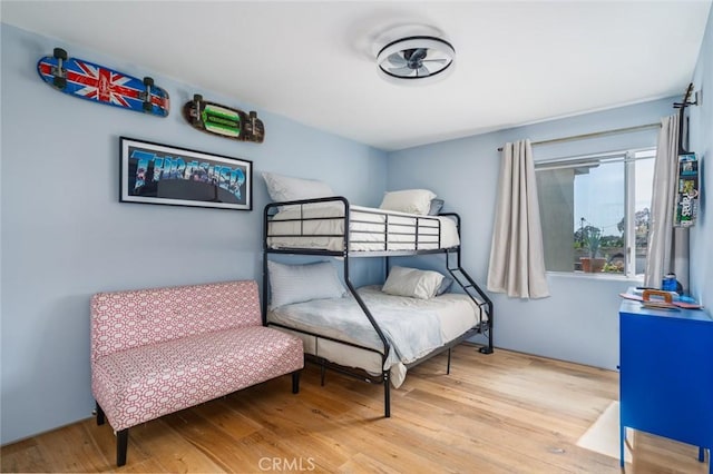 bedroom with wood finished floors