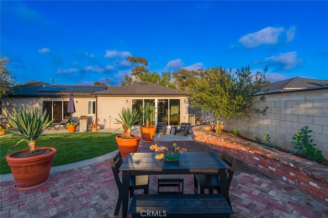 view of patio with a fenced backyard and outdoor dining space