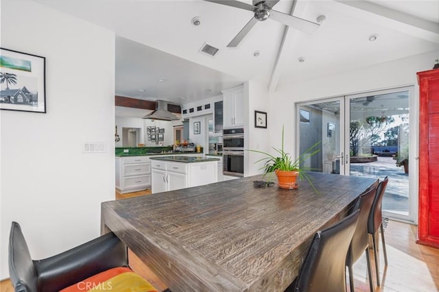 dining space with a ceiling fan, visible vents, light wood-type flooring, lofted ceiling with beams, and recessed lighting