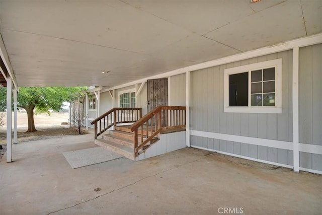entrance to property with a patio area