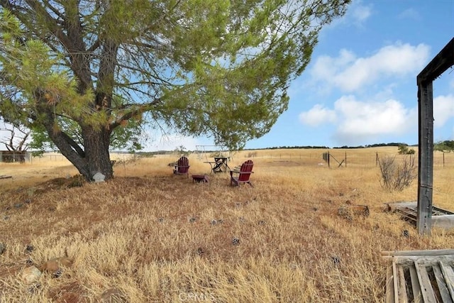 view of yard with a rural view