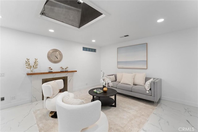 living room with visible vents, marble finish floor, and recessed lighting