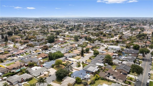 birds eye view of property with a residential view
