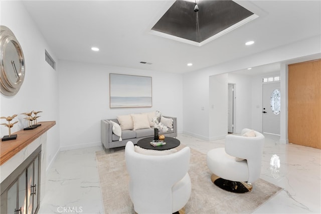 living area featuring visible vents, baseboards, marble finish floor, and recessed lighting
