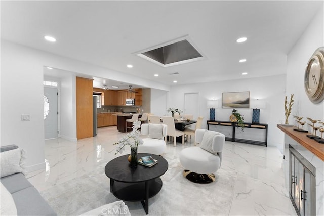 living room with marble finish floor and recessed lighting