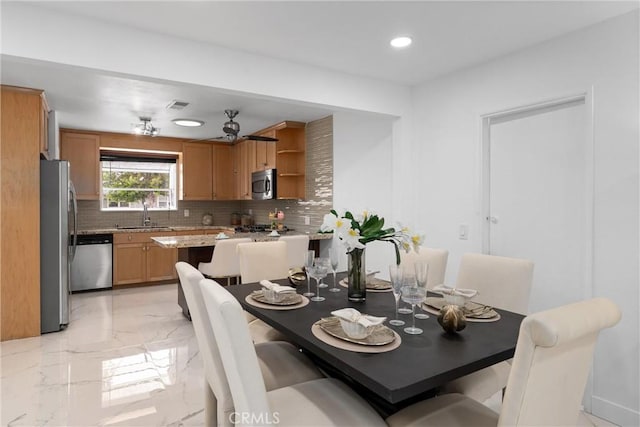 dining area with visible vents, marble finish floor, and recessed lighting