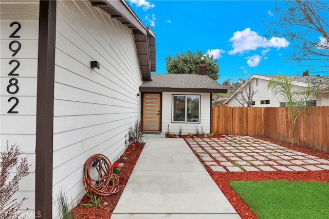 29282 Sonoma Way, San Juan Capistrano, CA 92675 - entrance to property featuring a patio, roof with shingles, fence, and a chimney