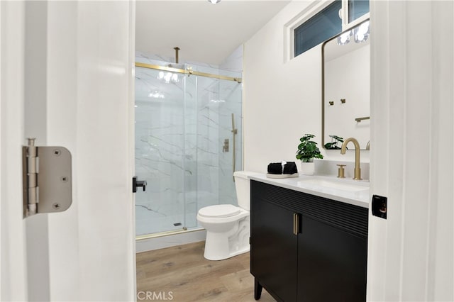 29282 Sonoma Way, San Juan Capistrano, CA 92675 - bathroom with a marble finish shower, vanity, toilet, and wood finished floors