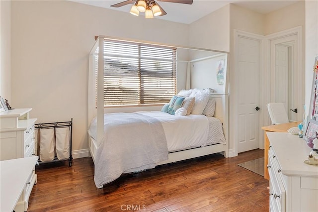 bedroom featuring ceiling fan and dark wood-style flooring