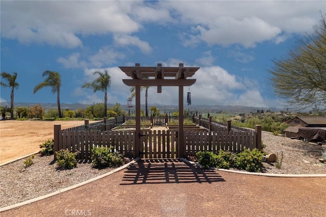 view of community with fence