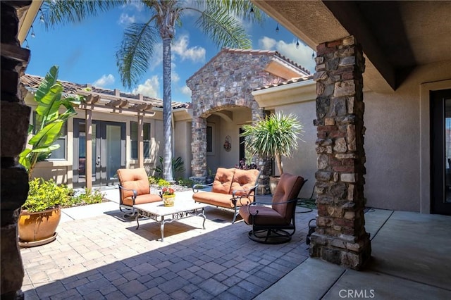view of patio with a pergola and an outdoor living space