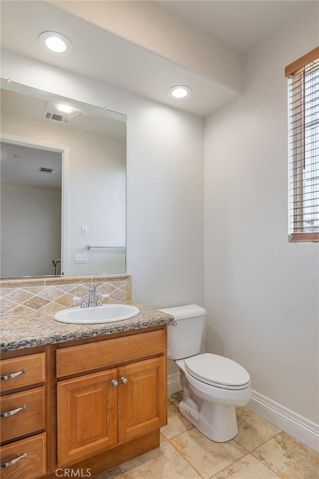 3863 Flowerwood Ln, Fallbrook, CA 92028 - half bathroom with vanity, toilet, and baseboards